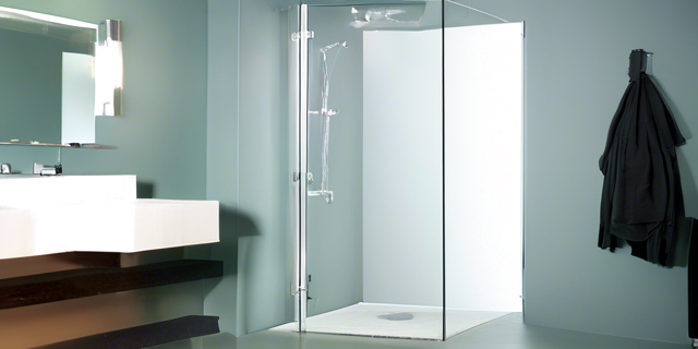 Consider a Glass Panel

If a shower door feels too cumbersome, think about installing a glass panel instead. This can keep water contained while maintaining an open look, further enhancing the sense of space.