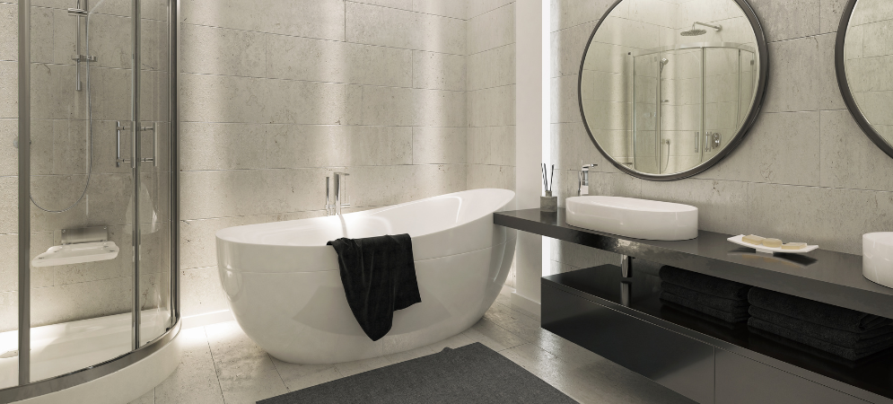 Modern Dubai bathroom renovated by Deco Wood featuring marble tiles, glass shower enclosure, and recessed LED lighting.