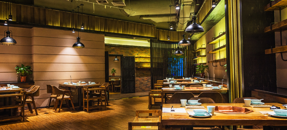 A modern Dubai restaurant interior renovated by Deco Wood, featuring custom joinery, ambient lighting, and elegant seating.