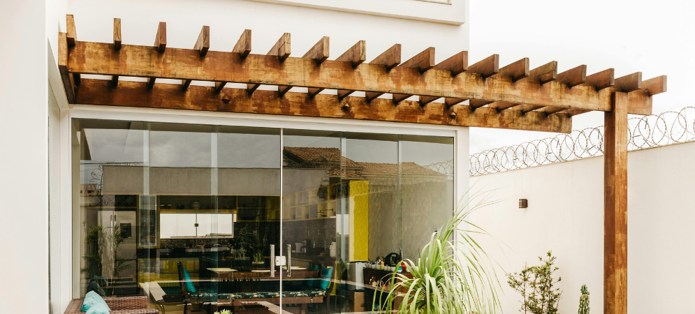 Custom timber-framed wooden pergola installed by Deco Wood in a luxurious Dubai garden.