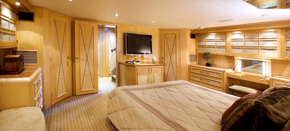 A luxury yacht hull being professionally vinyl wrapped by Deco Wood technicians in Dubai’s marina.